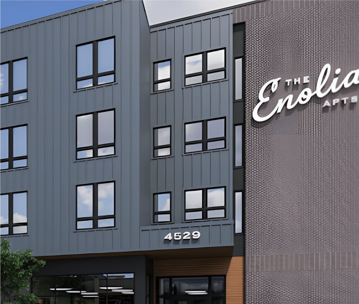 The Enolia, a modern mid-rise building with dark cladding and large windows.