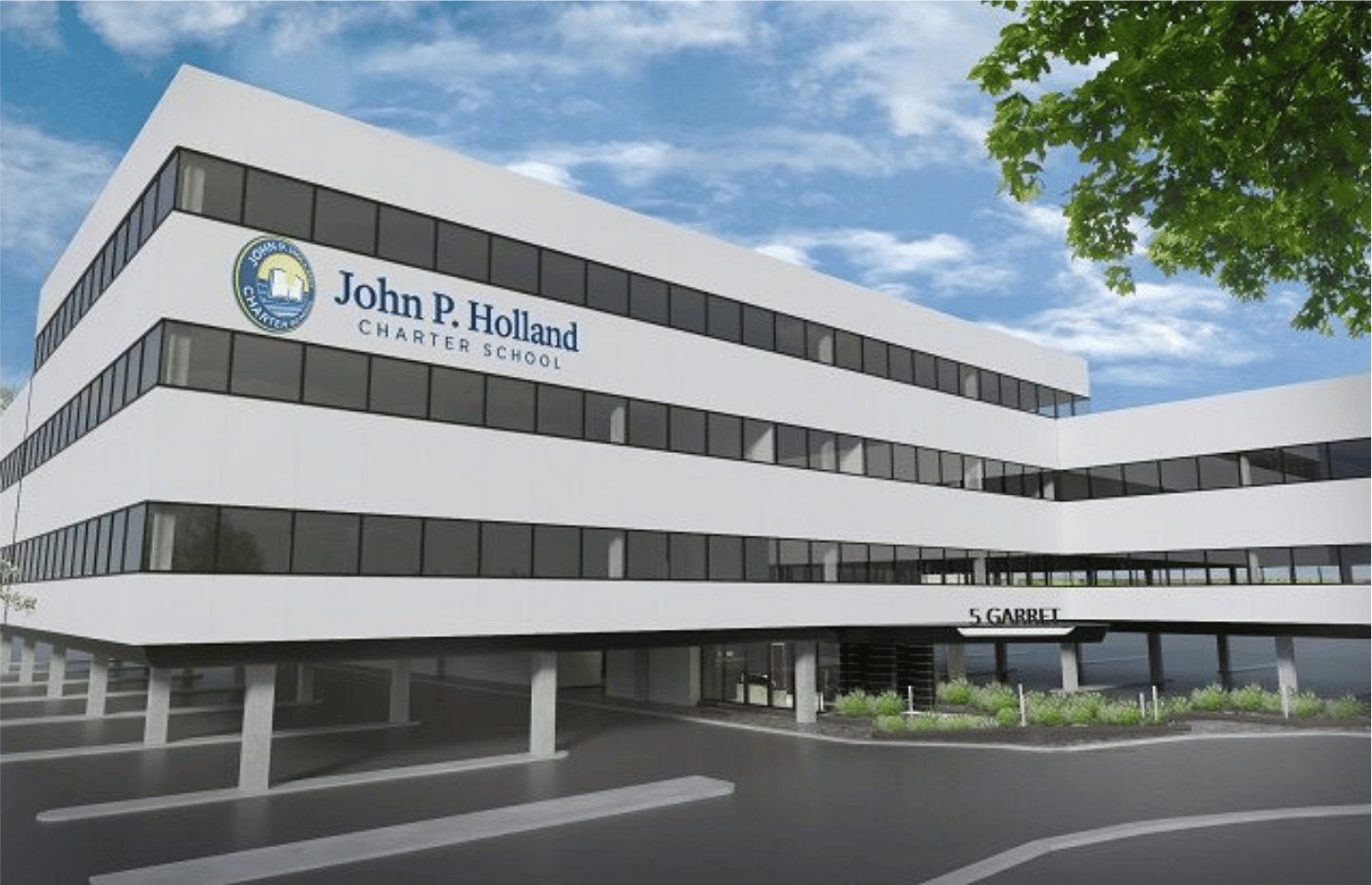 The exterior of the John P. Holland Charter School, a white multi-story building.